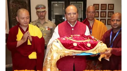 Lieutenant Governor of Ladakh Vinai Kumar Saxena carrying the holy relics (Photo/ANI)