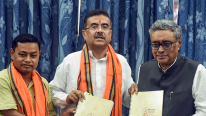 West Bengal CM Suvendu Adhikari, accompanied by State Finance Minister Swapan Dasgupta (right) and BJP MLA Anandamay Barman Hold Budget 2026 Book After Assembly Meeting (Photo/ANI)