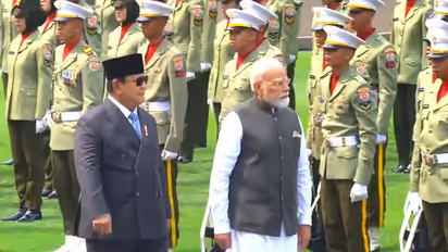 Prime Minister Narendra Modi receives a ceremonial Guard of Honour during his official welcome in Jakarta, Indonesia, on Tuesday. (Photo/ANI)
