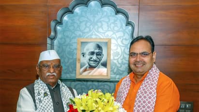 Rajasthan Chief Minister Bhajanlal Sharma with State Governor Haribhau Bagade, at Lok Bhavan in Jaipur. (ANI Photo)