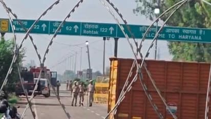 Haryana Police blocks the road leading towards Delhi at the Khanauri border (Photo/ANI)