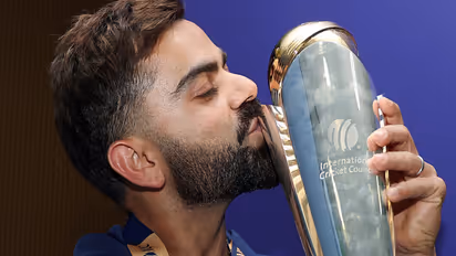 Virat Kohli with the ICC Men's Champions Trophy (Photo/ANI)