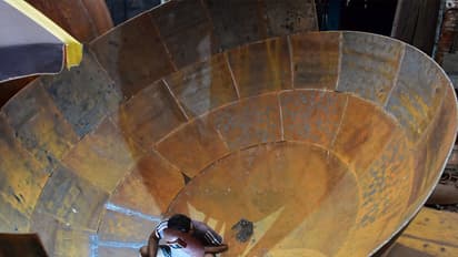 A labourer welding a giant iron pot at an iron factory in Kolkata (File Photo/ANI)
