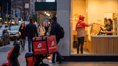 Delivery Hero – Delivery rider picking up food up at a vendor store (Photo/Delivery Hero)