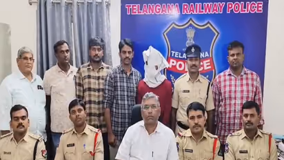 Telangana Railway Police officials with the accused ganja peddler in Secunderabad on Monday. (Photo/ANI)