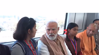Prime Minister Narendra Modi interacting with students onboard metro (Photo/ANI)