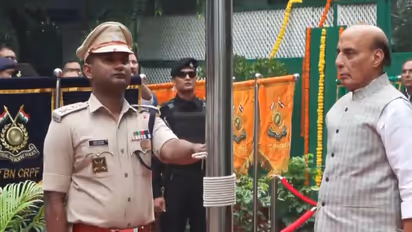 Defence Minister Rajnath Singh hoists tricolour at residence on 80th Independence Day (Photo/ANI)