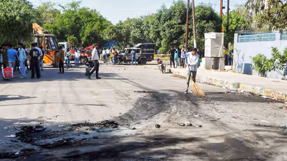 Employees of a company protest demanding a salary increment in Noida (Photo/ANI)