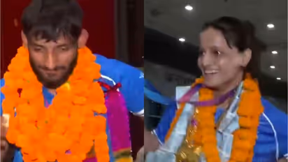 Gold medallist and Indian Judoka Harsh Singh (left) and Asmita Dey (right) welcomed at Delhi Airport (Photo/ANI)