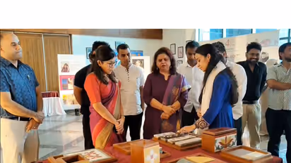 NIFT Budgam student showcasing her creations to J&K Transport Secretary Avny Lavasa (Photo/ANI)
