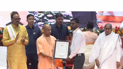 Yogi Adityanath gives appointment letter to candidates (Photo/ANI)