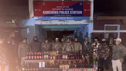 Police with the seized liquor at the Kakching Police Station in Manipur (Photo/Manipur Police)