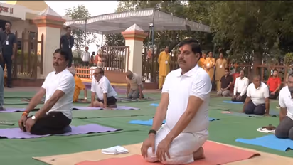 MP CM Mohan Yadav performing Yoga (Photo / ANI)