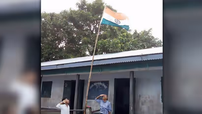 There is a tragic story behind this viral picture of teachers-students hoisting the flag in flooded Assam
