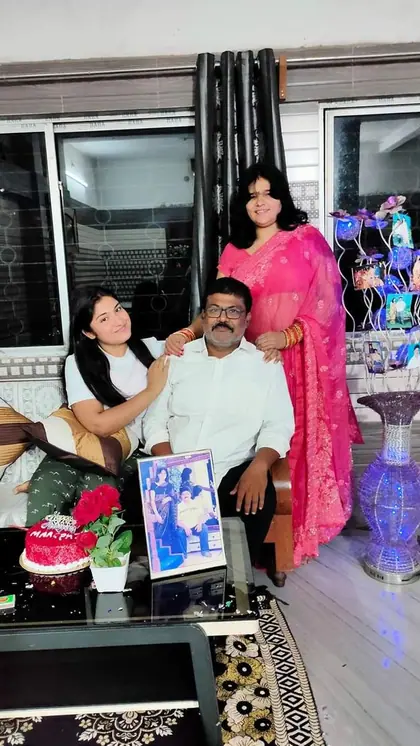Raksha’s father is a businessman, and her mother is a homemaker.
