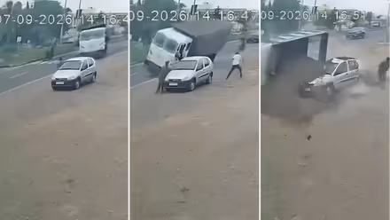 Miraculous Escape: 2 Run For Life as Speeding Sand Dumper Overturns on Gujarat Highway After Avoiding Biker (WATCH)