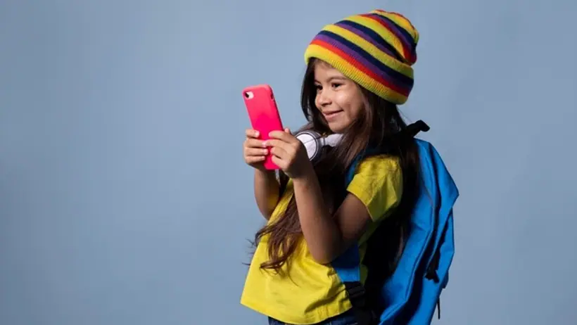 school girl checking her phone
