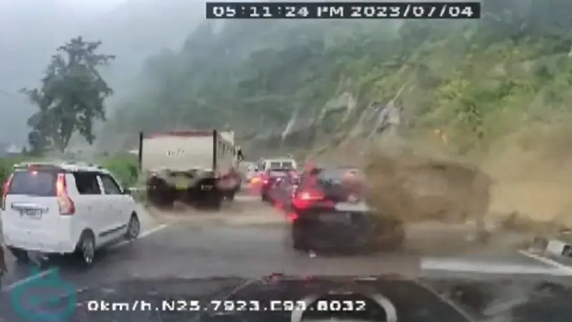 Massive rock crushes cars
