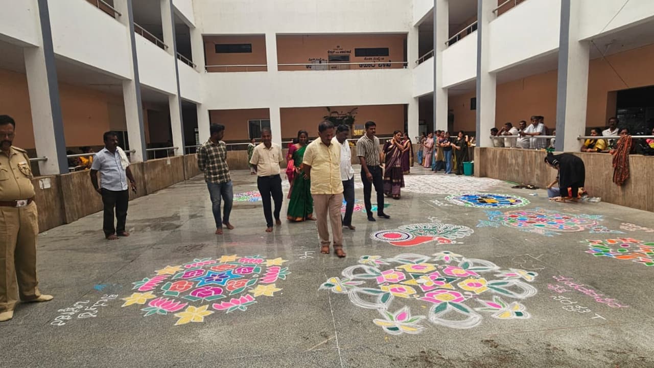 dasara: women create vibrant rangoli designs using a kaleidoscope of ...